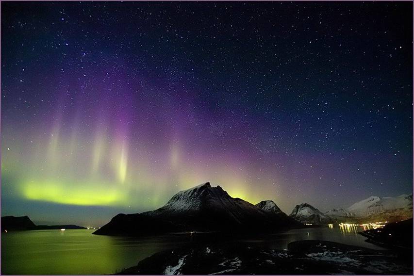 aurora over mountain and water