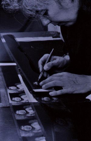 Caroline Leaf scratching on film creating her animation Two Sisters