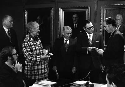 Founding President Charles J. McCann; Founding Trustees Janet L. Tourtellotte (Holmes); Al E. Saunders, Halvor M. Halvorson - presenting Evergreen's first catalog to Governor Daniel J. Evans, spring 1970
